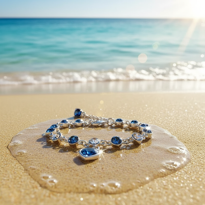 Lucky Heart Crystal Bracelet on beach sand - luxury ocean scene