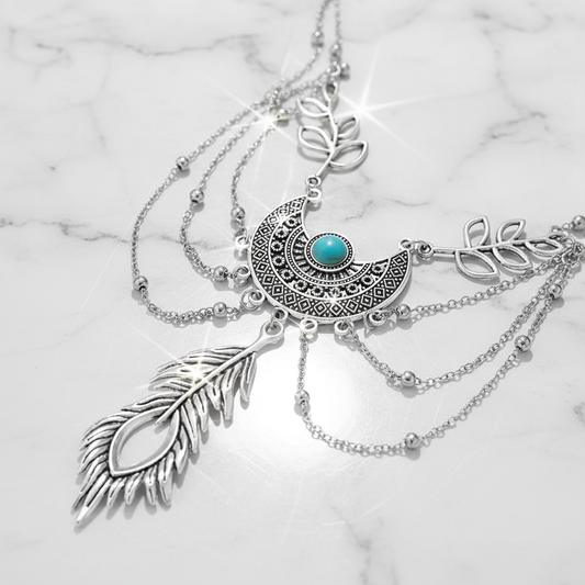 Pulseira de mão boho com lua e pena em mármore branco